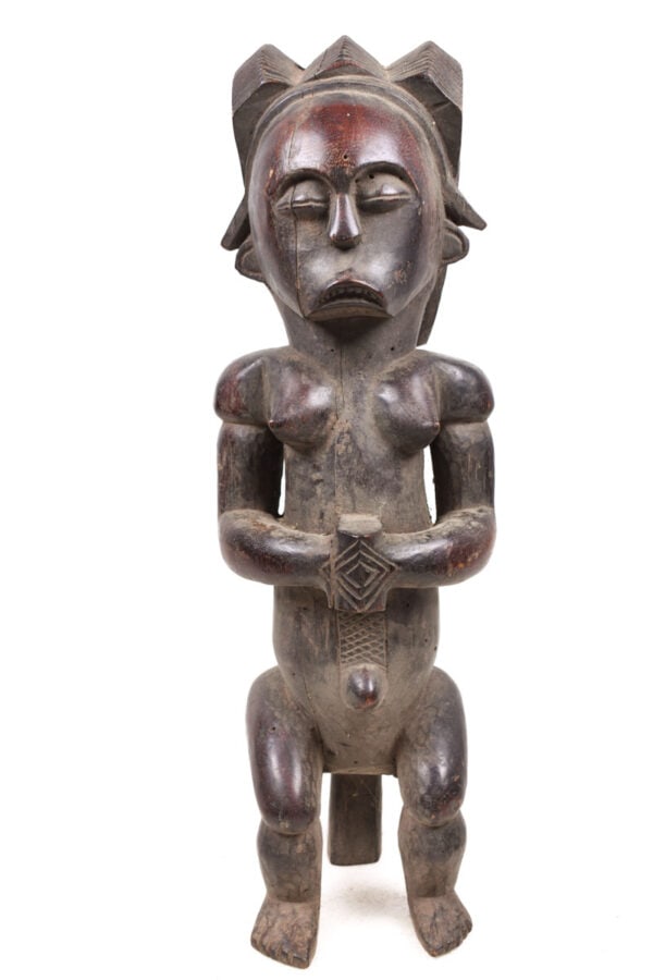 Byeri Figure – Wood – Fang – Gabon: Large wooden Fang Byeri figure form Gabon. Fang Byeri figures are usually characterized as a seated male figure. He has bent legs and an elongated torso, The Fang occupy such a large geographical area