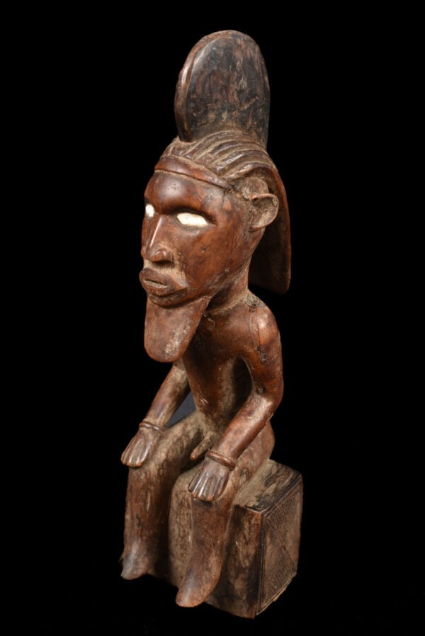 Power Figure – Wood – Bembe – DR Congo: Great refined ancestor figure from the Babembe people of DR Congo. Good aged patina with beautifull scarifications and traces of libations. The function of Bembe art is said to be primarily concerned 
