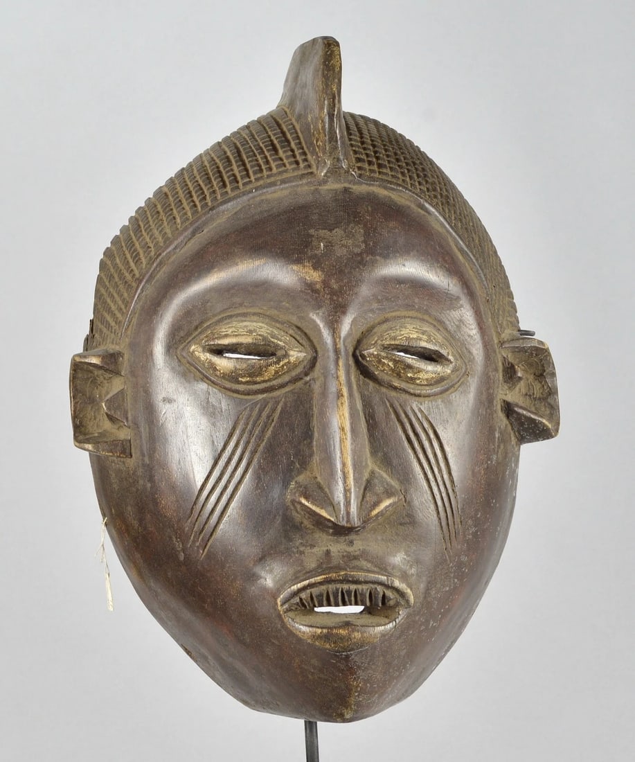 African Art - Large & impressive wooden Mask Probably from Nigeria 16": Large & impressive Wooden Mask Country: Probably from Nigeria People: ? Material: Wood Dimension: About 16 1/2 inches high Condition: medium Second half of the 20th century Sold without the stand Rese