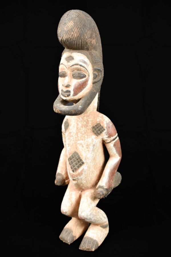Ancestor Figure – Wood – Punu – Gabon: Beautiful Punu ancestor figure from Gabon. It is thought they were used as prestige objects, during magical cermonies, or were kept alongside the ancestral bones in a reliquary box. The forehead is co