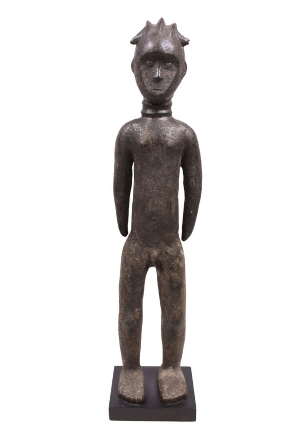 Ancestor Figure – Wood – Toma – Guinea: Powerful Toma figure from Guinea. The Toma wood figure, hand-carved in West Africa, exemplifies the artistic skill of the Toma people. This sculpture, intricately detailed and adorned, serves as a tes