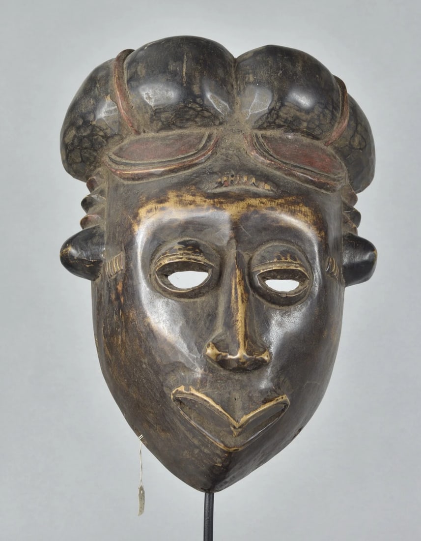 African Art Cameroon or Nigeria Large wooden Mask: Large Mask Country: Cameroon or Nigeria People: ? Material: Wood Dimension: About 15 inches high Condition: medium Sold without the stand Reserve: $200.00 Shipping: Domestic: Flat-rate of $45.00 to