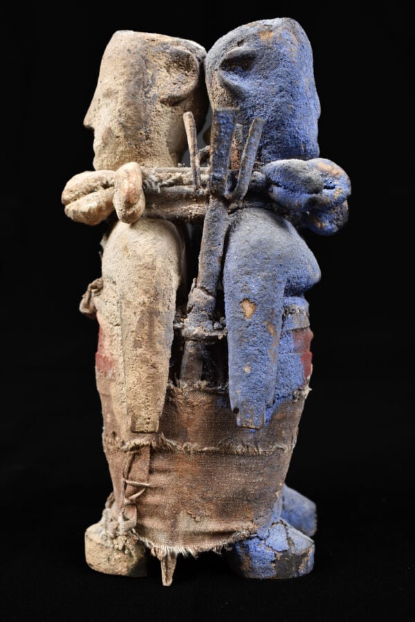 Fetish figure – Wood – Adan Ewe – Togo: A fine janus wooden fetish figure from the Adan tribe of Togo. Great color silhouette, use of colors blue and white. Contains clear traces of tribal libations. Ewe fetishes, which acquire power