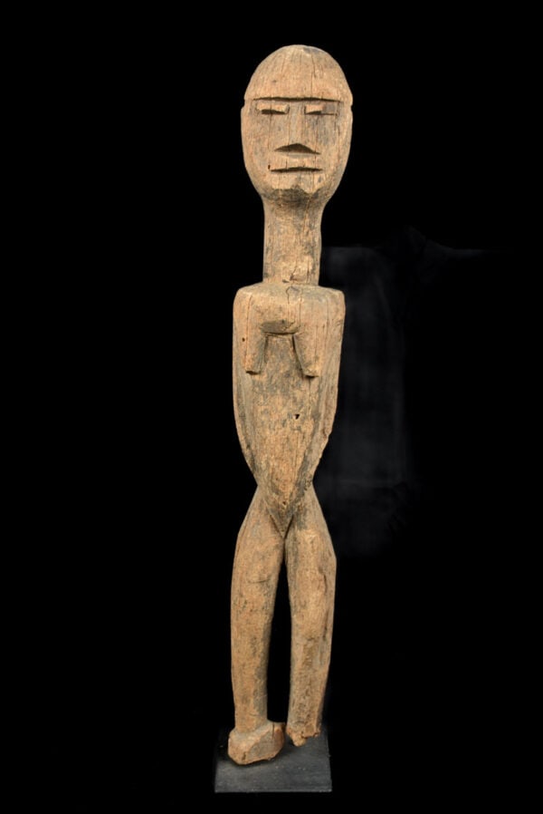 Ancestor Figure – Wood – Lobi – Burkina Faso: Powerfull Lobi figure with raised arm from Burkina Faso. Lobi Figures are the enigmatic, brooding sculpture that protect the Lobi people of Burkina Faso. Most are frontal, symmetrical and timeless