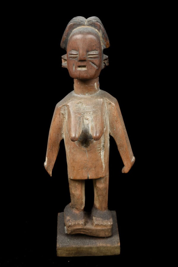 Venavi figure – Wood- Ewe – Togo: A fine venavi figure made out of wood. This miniature is used as a doll among the Ewe people. The Ewe people of Ghana celebrate the birth of twins as a good omen. Twins known as Venavi, lead a life