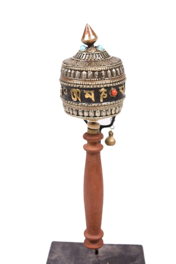 Prayer wheel – Wood, Copper – Tibet: Tibetan prayer wheels (Mani) are rotating cylinders and a religious devotion instrument for Tibetans. A prayer wheel is a cylindrical mill that rotates around a vertical axis. It is usually made of