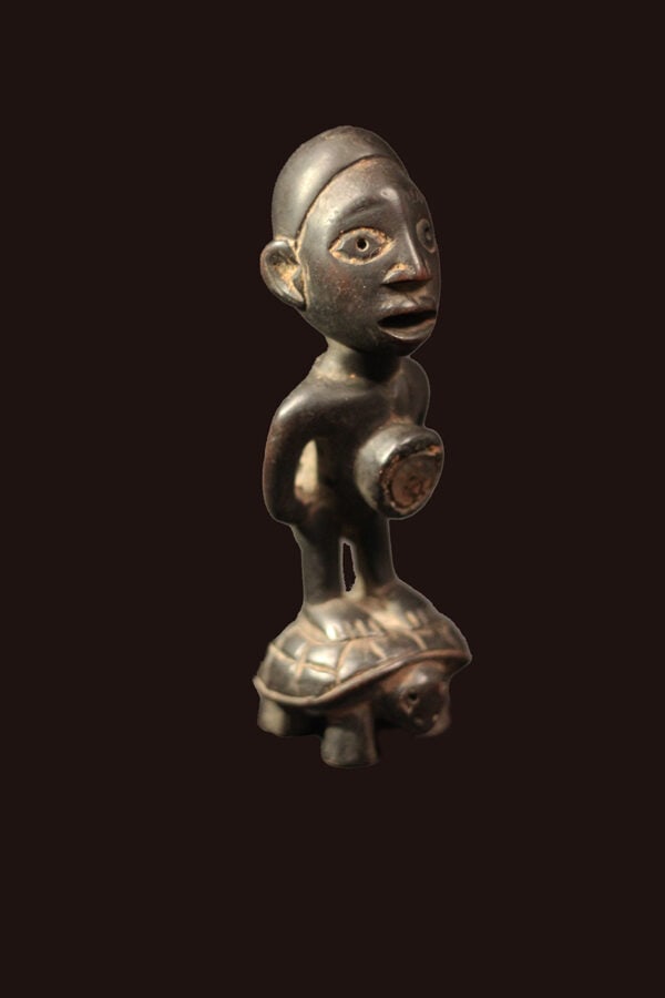 Figure – Wood – Bakongo Vili – Congo: Stylistic Bakongo Vili ancestor figure from Congo. Powerful appearance with with a great aged patina with traces of tribal use. The figure is standing on the back of a turtle. Object: Figure Ethnic