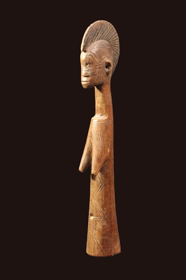 Fertility Doll – Wood – Mossi – Burkina Faso: A very traditional styled Mossi Biga fertility doll, The doll displays the characteristics of an adult woman, with suggestions of facial features and elaborate hairstyles, and usually with mature