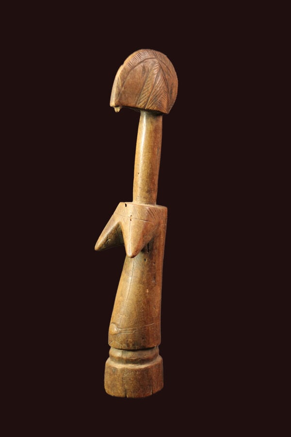 Fertility Doll – Wood – Mossi – Burkina Faso: A very traditional styled Mossi Biga fertility doll, The doll displays the characteristics of an adult woman, with suggestions of facial features and elaborate hairstyles, and usually with mature