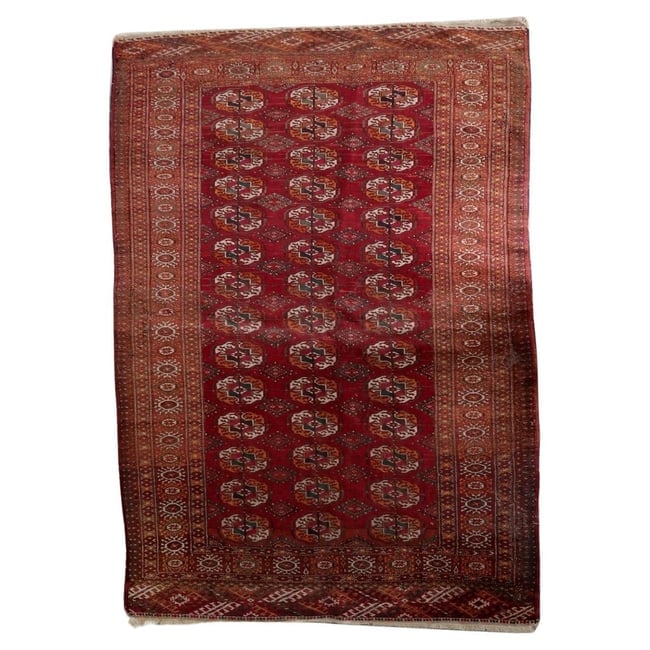 Authentic Antique Turkmen Tekke Rug 4.4' x 6' - Gul Motifs: Title: Authentic Antique Turkmen Tekke Rug 4.4' x 6' - Gul Motifs Origin: Turkmenistan Dimension:4.4' x 6' Materials:wool Year:1920s Description:An exceptional Authentic Antique Turkmen Tekke Rug