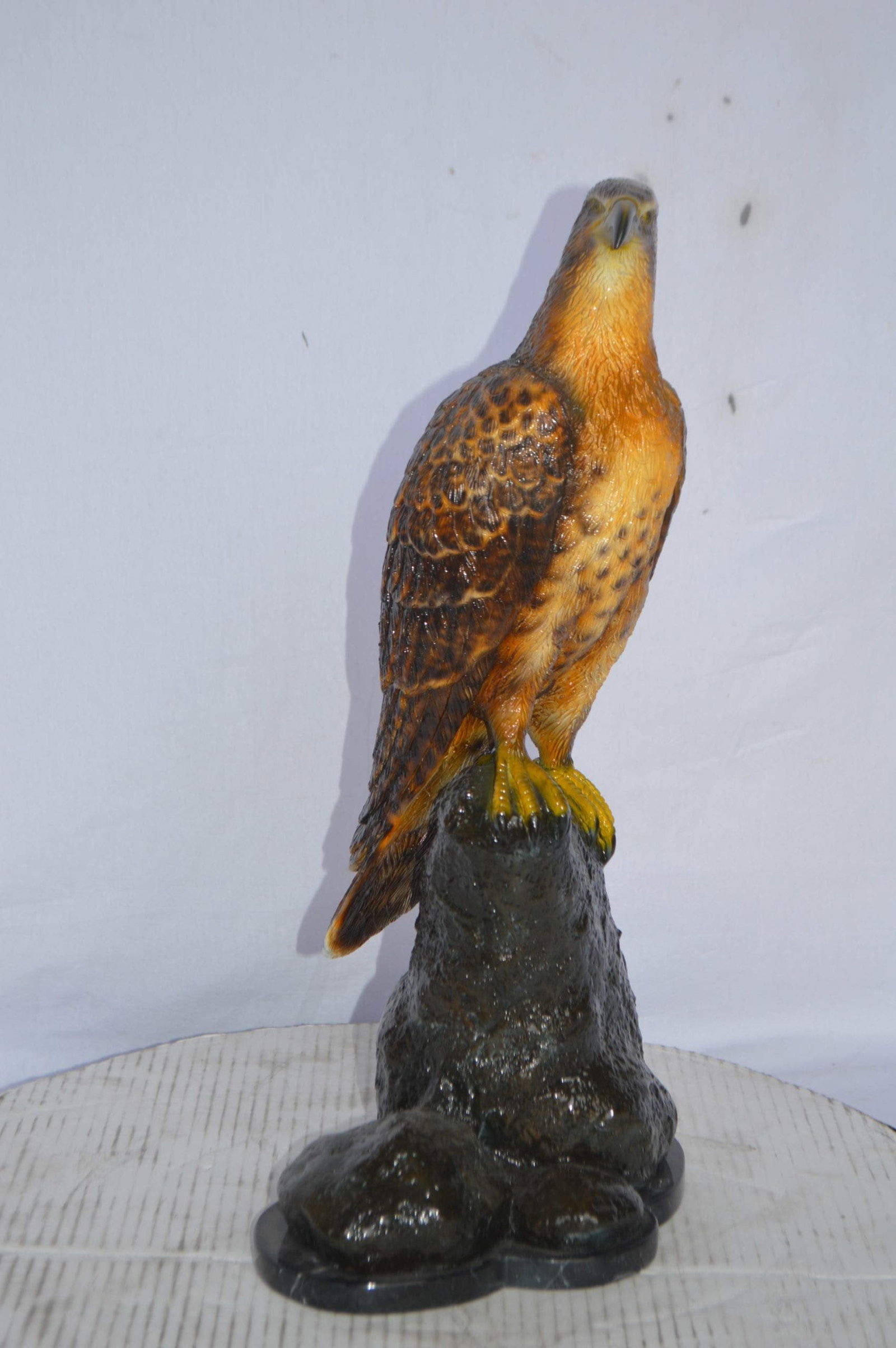 Hawk on a Rock bronze statue - Size: 12"L x 9"W x 22"H. - 4