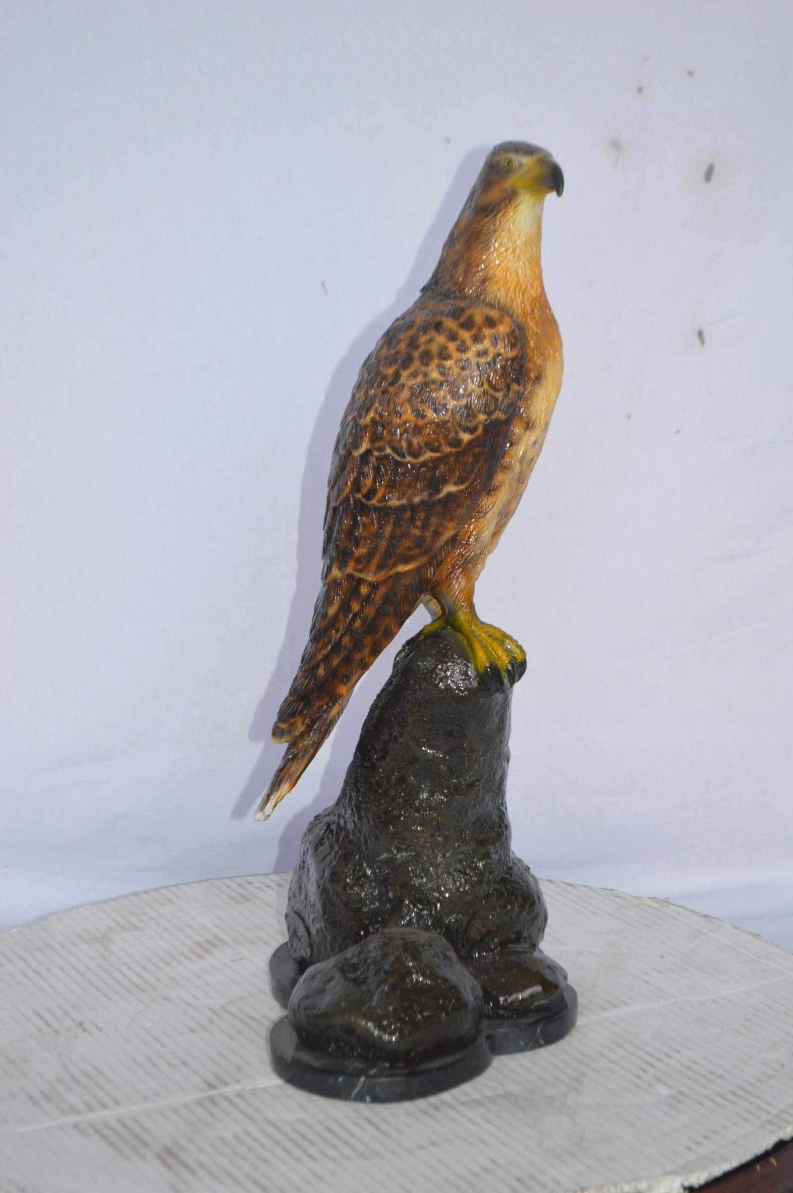 Hawk on a Rock bronze statue - Size: 12"L x 9"W x 22"H. - 5