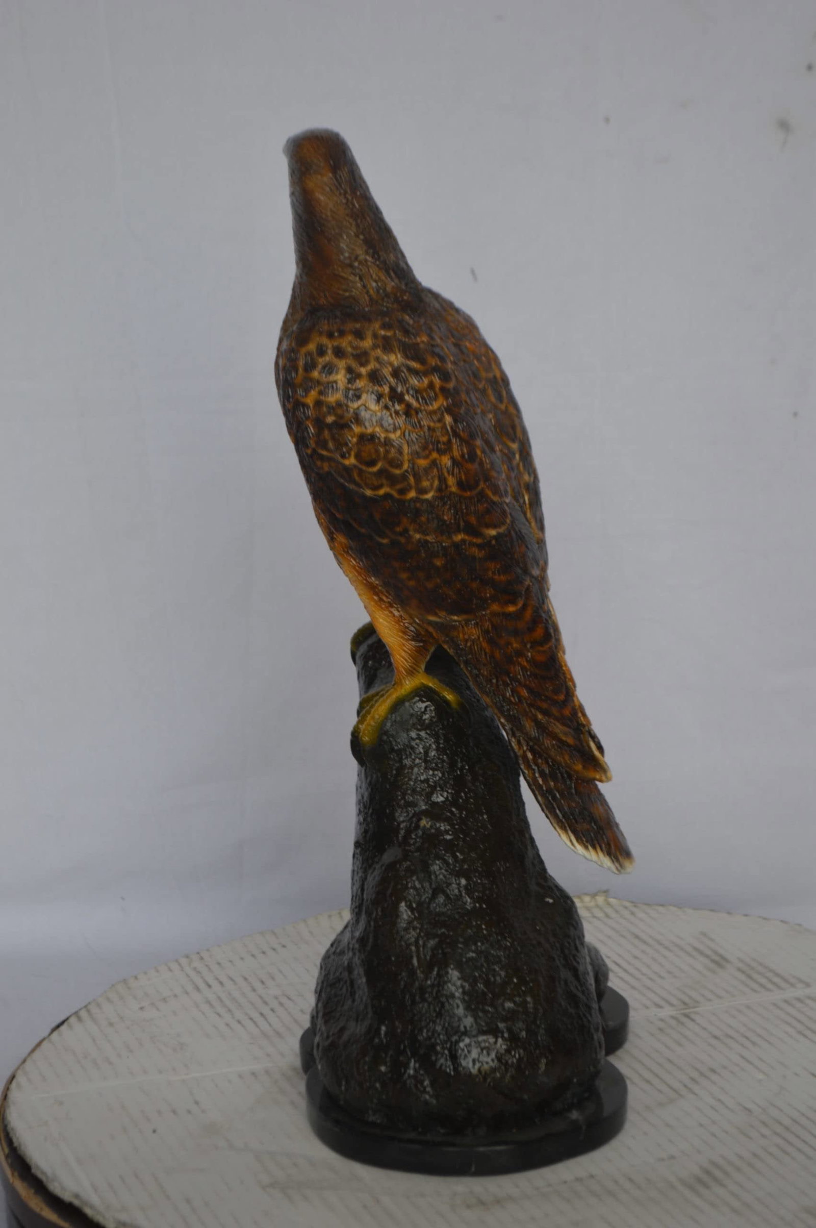 Hawk on a Rock bronze statue - Size: 12"L x 9"W x 22"H. - 9
