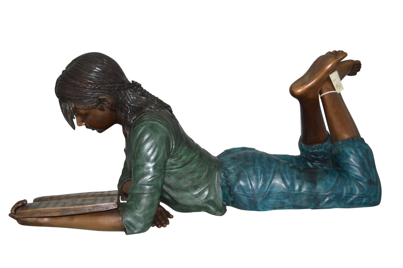 Kate Reading a Book Bronze Statue - Size: 42"L x 18"W x 17"H.: Title:Kate Reading a Book Bronze Statue - Size: 42"L x 18"W x 17"H. Description:Magnificent large size bronze statue of a young girl laying down outside and reading a book. The joy of youth, lost in a