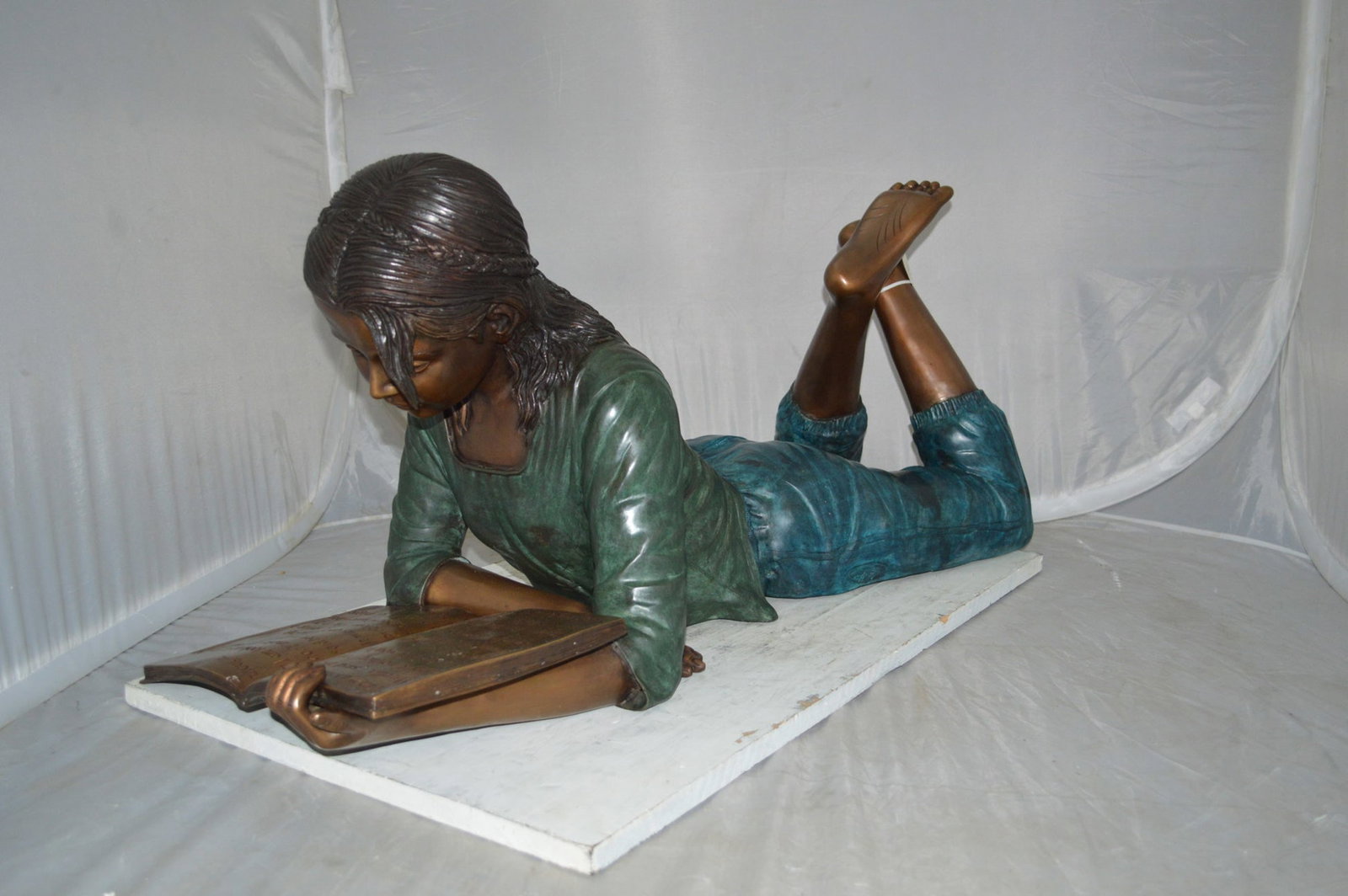 Kate Reading a Book Bronze Statue - Size: 42"L x 18"W x 17"H. - 5