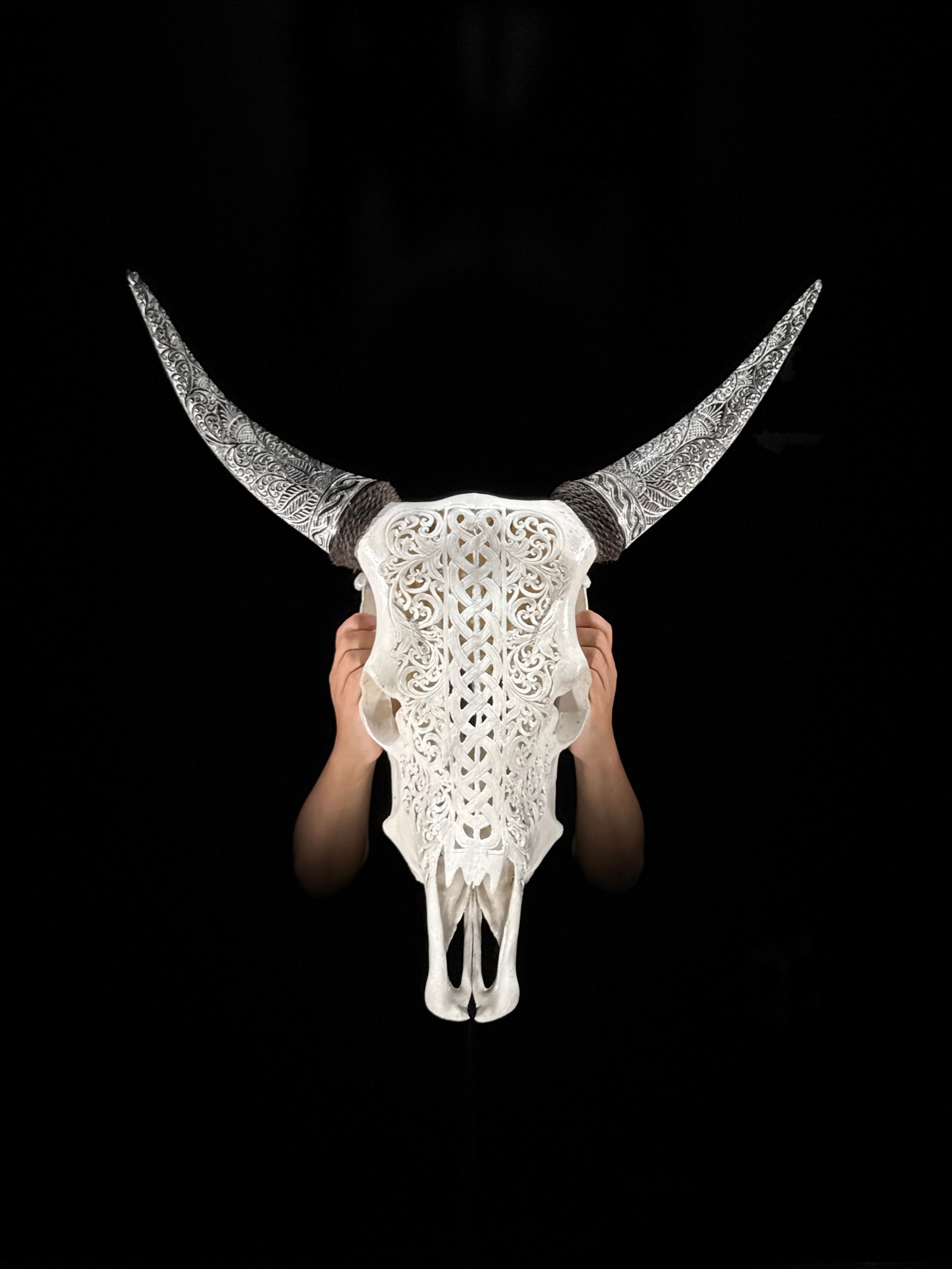 Carved Cow Skull with carved horns - Infinity Motif: Title: Carved Cow Skull with carved horns - Infinity Motif Maker:Unknown Origin: Indonesia Date/Period:2026 Materials:Bos Taurus, Bone, Horn Dimensions:Height: 57 cm / 22.4 inches Width: 55 cm / 21.6