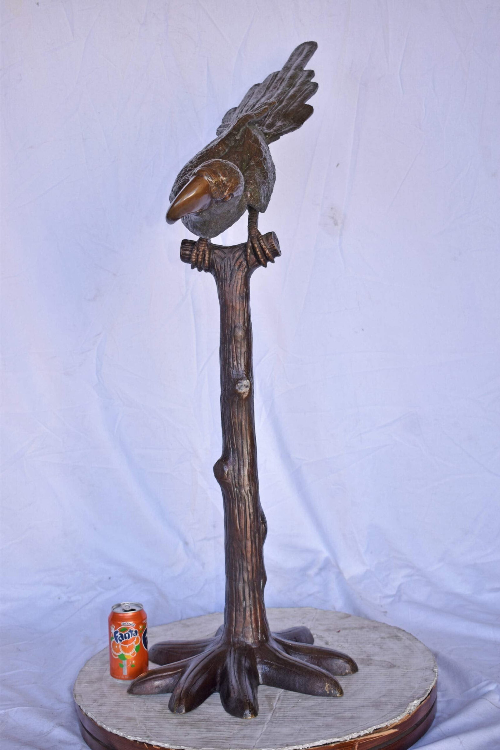 Parrot on a Tree looking Down Bronze Statue - Size: 37"L x 15"W x 47"H. - 5