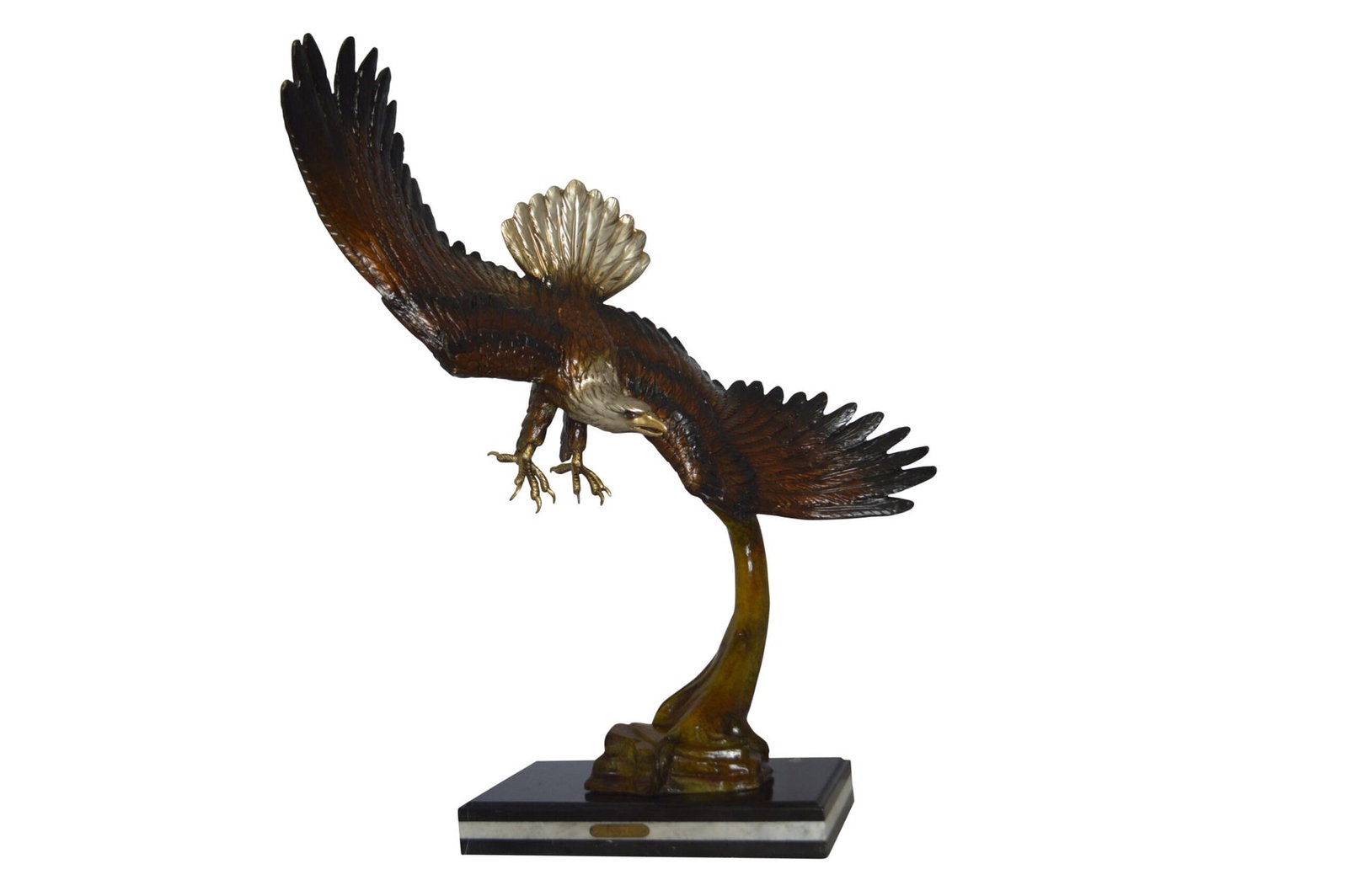 Eagle Soaring Bronze Statue by W Aribu - Size: 35"L x 27"W x 38"H.: Title:Eagle Soaring Bronze Statue by W Aribu - Size: 35"L x 27"W x 38"H. Description:A large eagle made of bronze landing on a tree. This extraordinary sculpture features a realistic tree trunk that s