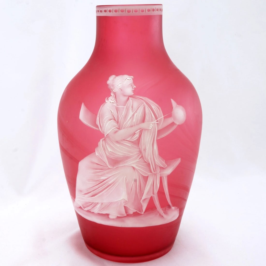 19th C Thomas Webb Cameo Glass Vase: Title:19th C Thomas Webb Cameo Glass Vase Size:9 ¼ in (23.5 cm) tall x 5 ¼ in (13.3 cm) diameter. Description:A thin cranberry glass vase that has been overlaid with white glass and then