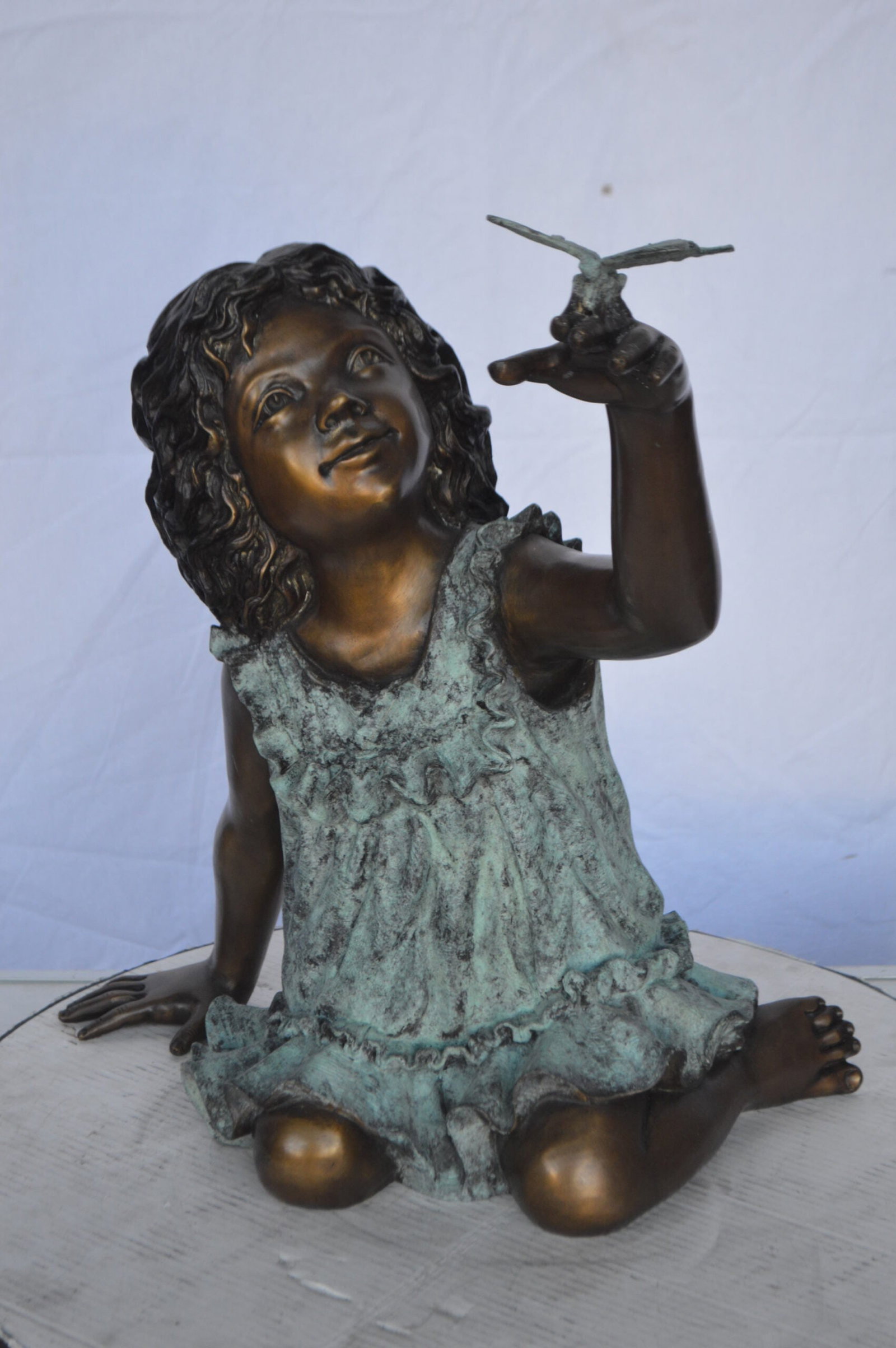 Girl Playing With Butterfly Bronze Statue - Size: 21"L x 15"W x 19"H. - 3