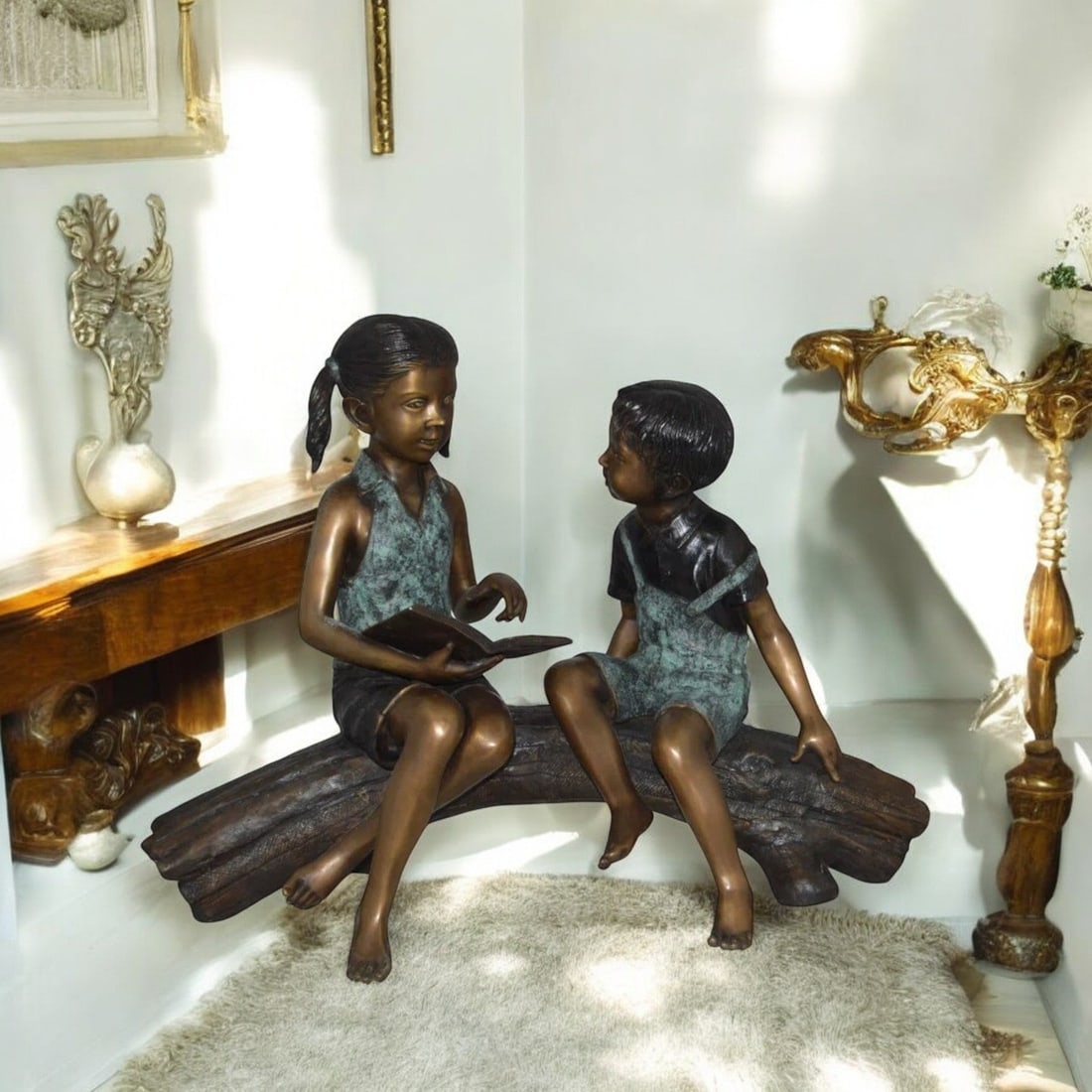 Boy and Girl on a tree log reading Bronze Statue - Size: 37"L x 14"W x 27"H. - 2