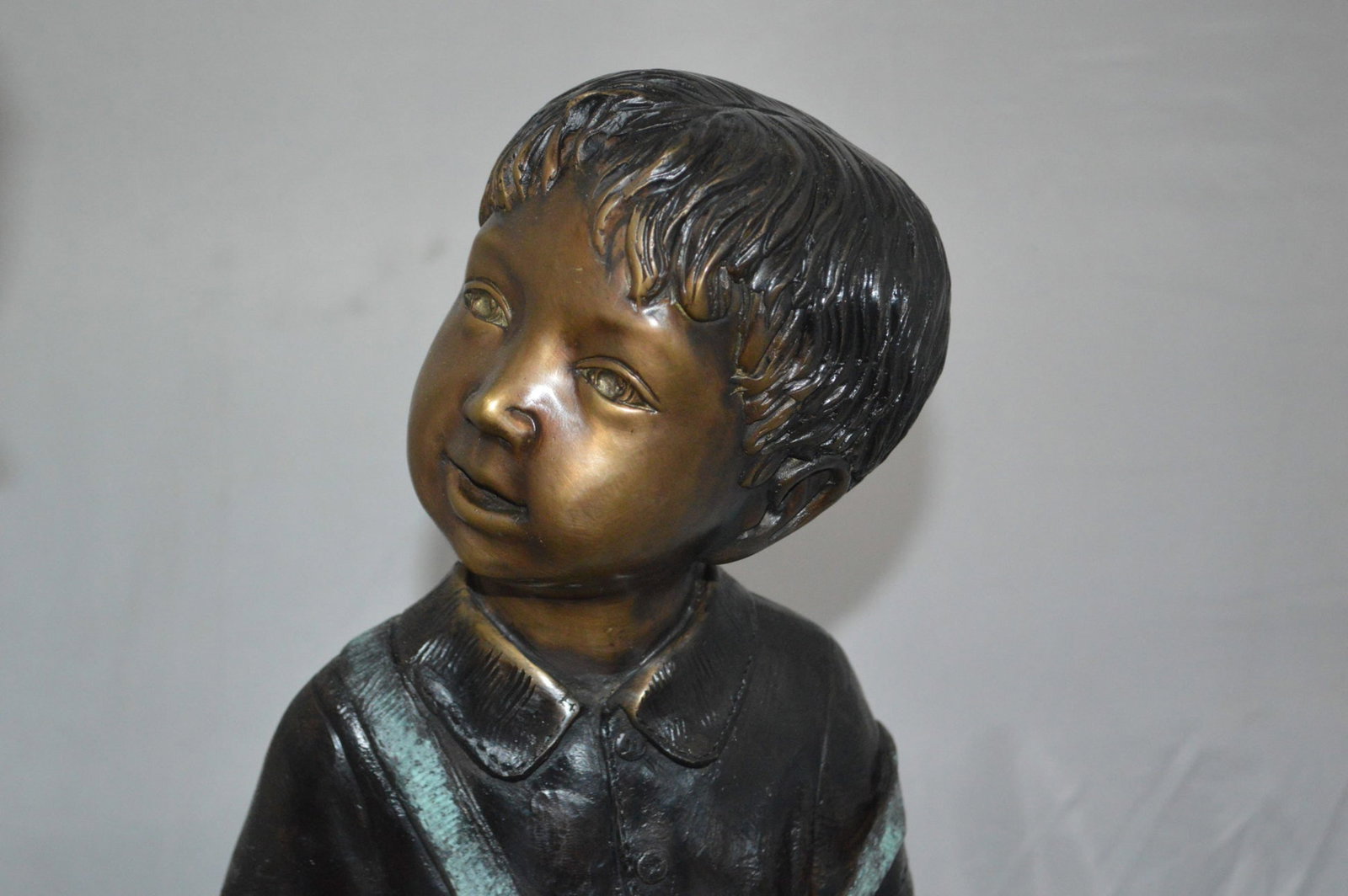 Boy and Girl on a tree log reading Bronze Statue - Size: 37"L x 14"W x 27"H. - 5