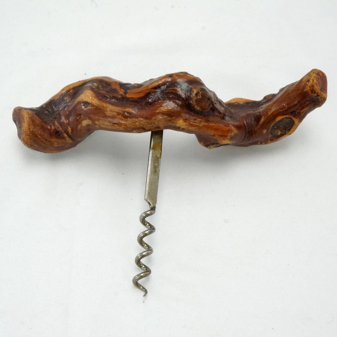 Vintage French Grapevine Root Corkscrew: Title:Vintage French Grapevine Root Corkscrew Size:7 in (17.8 cm) wide x 4 7/8 in (12.4 cm) tall. Description:A piece of grapevine has been cleverly made into a corkscrew. It has a good feel when bein
