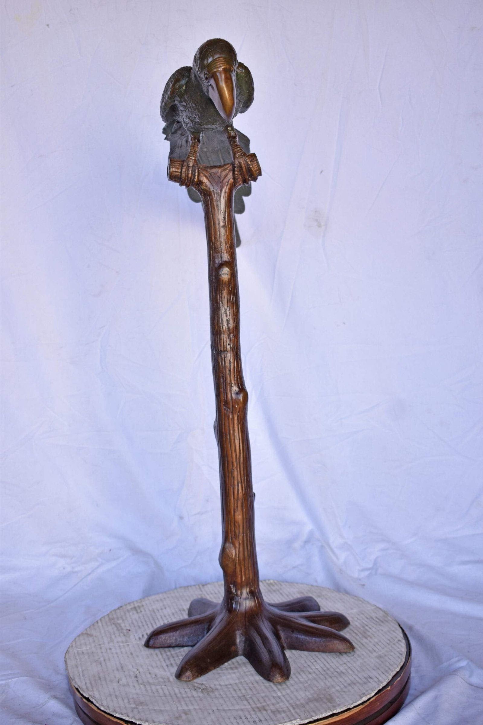 Parrot on a Tree Watching Forward Bronze Statue - Size: 36"L x 15"W x 41"H. - 6