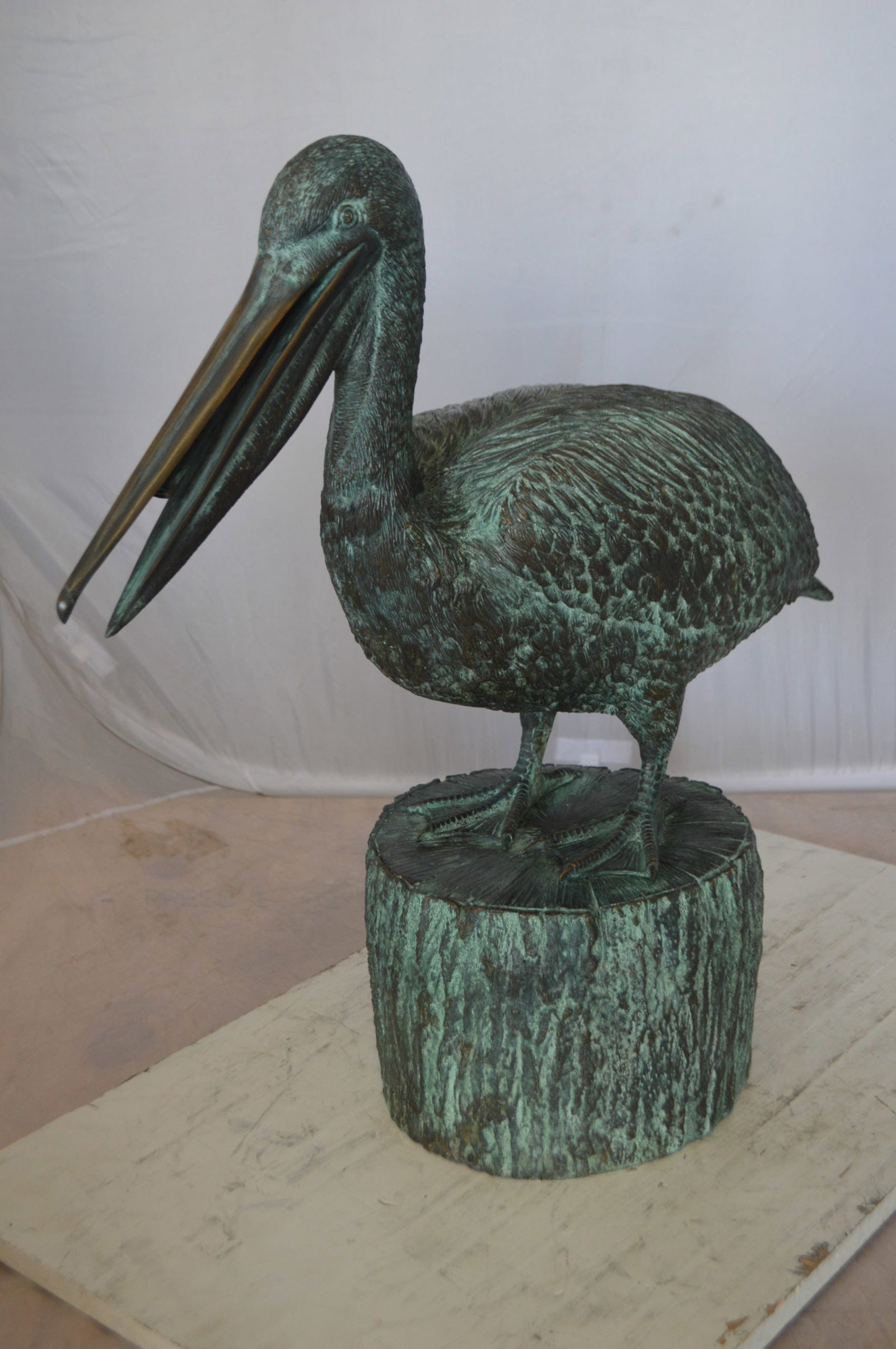 Pelican on a Tree Stump fountain bronze statue - Size: 30"L x 16"W x 30"H. - 3
