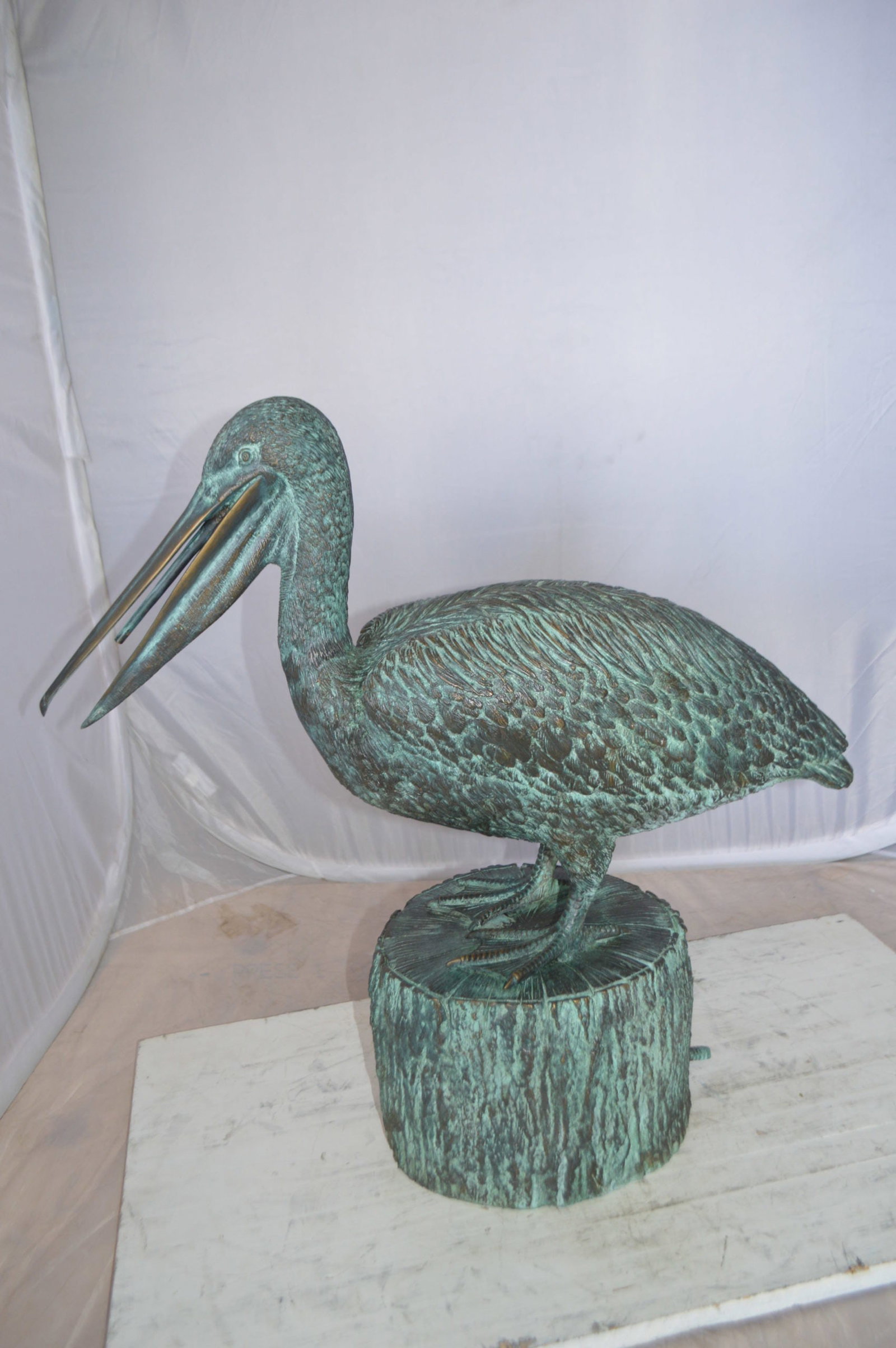 Pelican on a Tree Stump fountain bronze statue - Size: 30"L x 16"W x 30"H. - 5