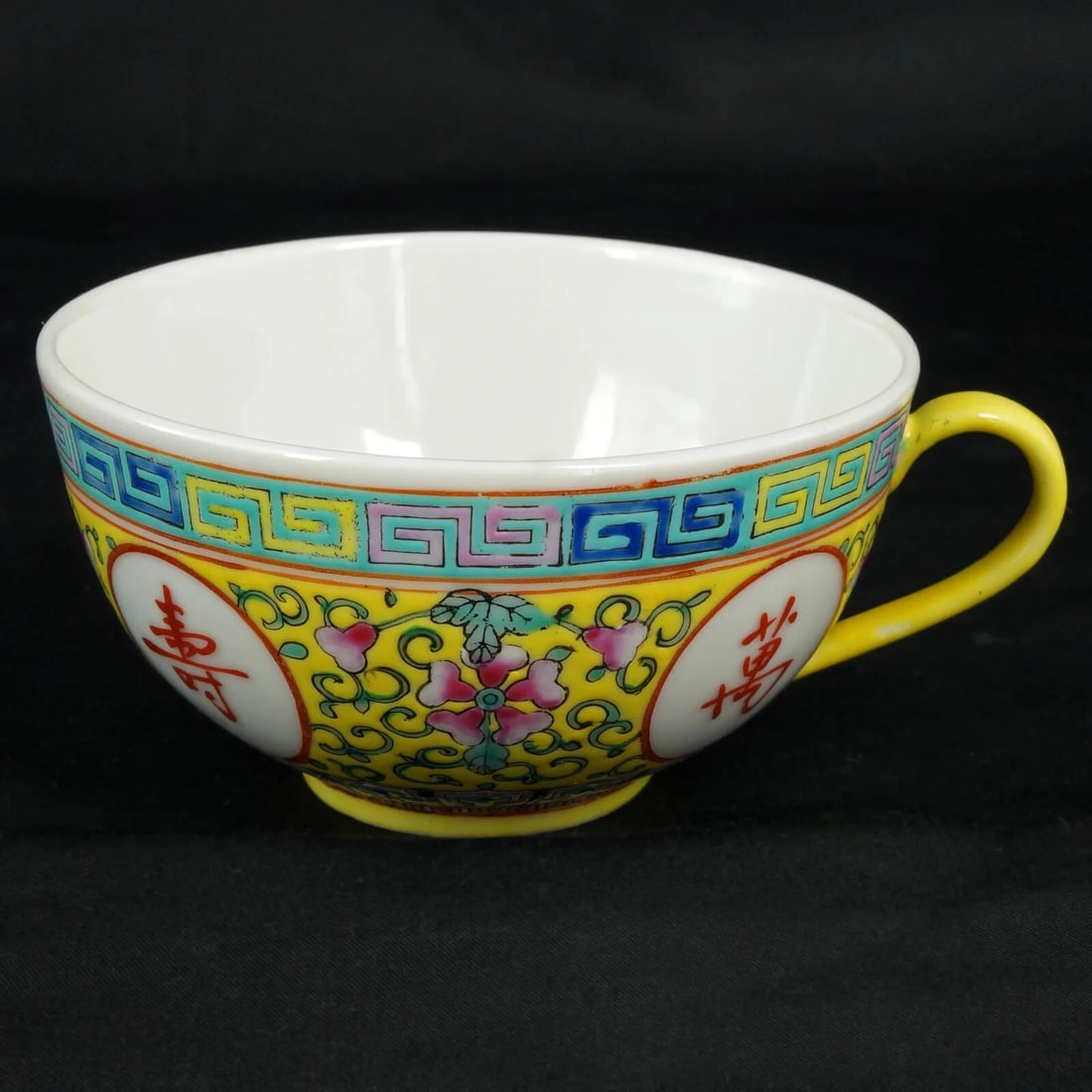 19th C Chinese Yellow Ground Teacup Marked: Title:19th C Chinese Yellow Ground Teacup Marked Size:3 5/8 in (9.2 cm) diameter x 2 in (5.1 cm) tall. Description:A richly hued and exquisitely rendered Guangxu period (1875 to 1908) teacup with