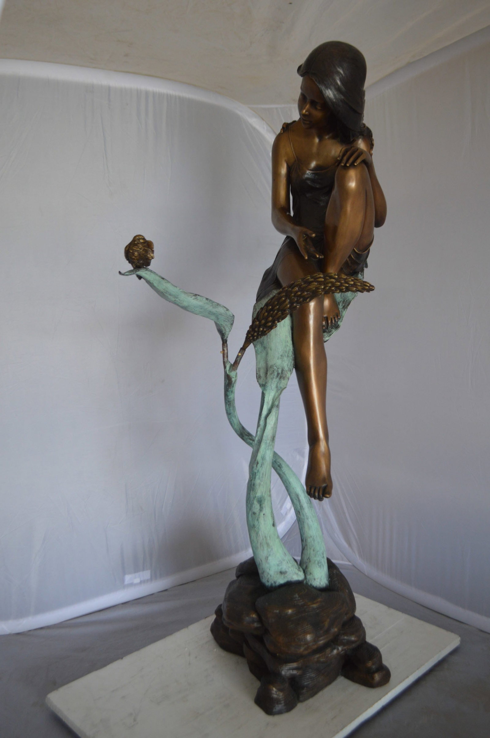 Beautiful Young Girl Sitting on a Tree Bronze Statue - 35"L x 50"W x 55"H. - 12