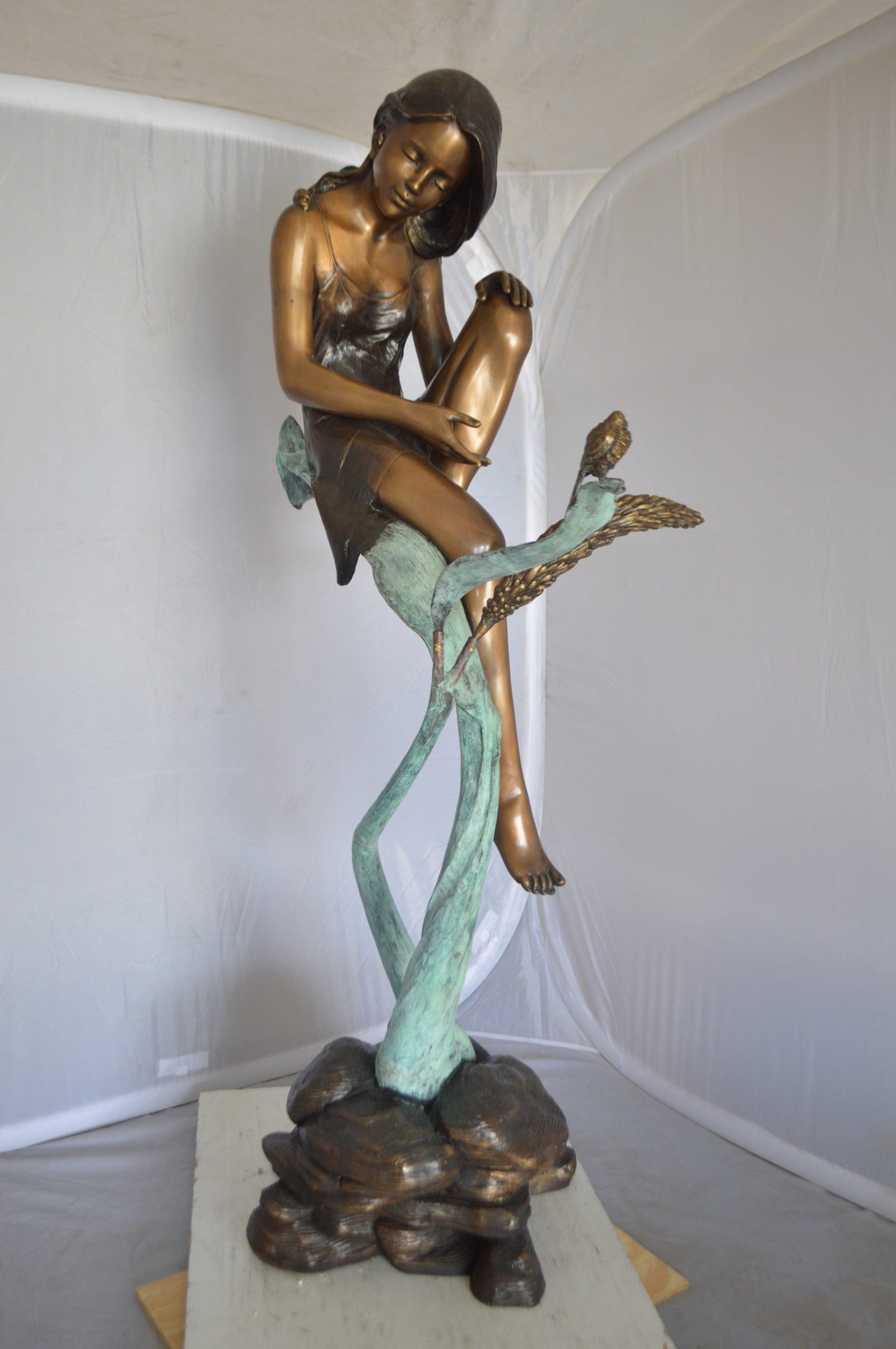 Beautiful Young Girl Sitting on a Tree Bronze Statue - 35"L x 50"W x 55"H. - 13