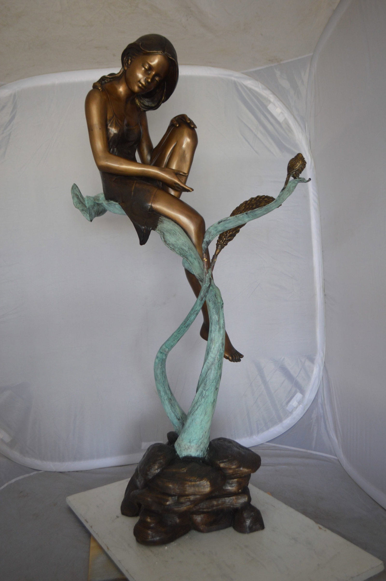 Beautiful Young Girl Sitting on a Tree Bronze Statue - 35"L x 50"W x 55"H. - 6