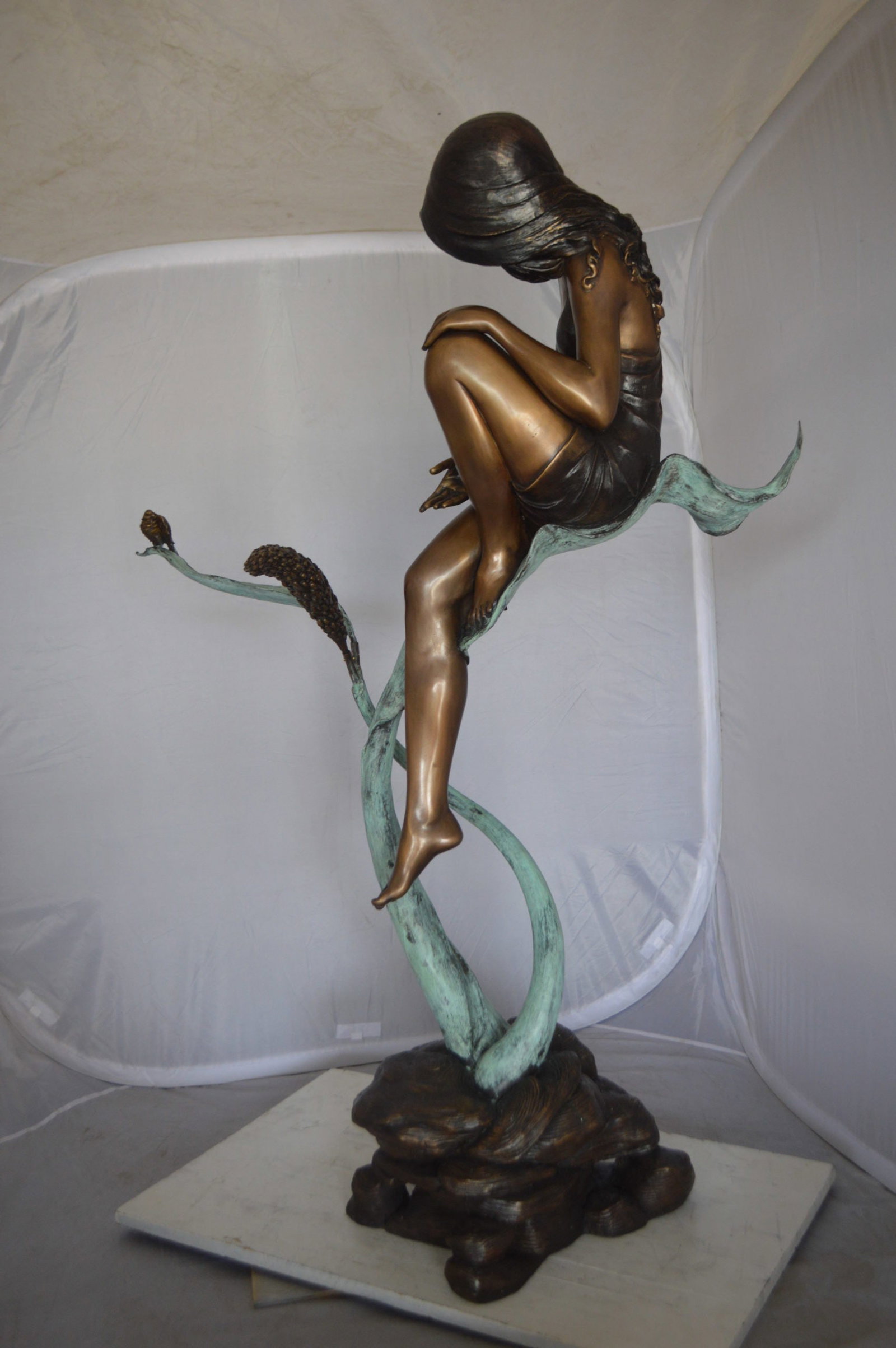 Beautiful Young Girl Sitting on a Tree Bronze Statue - 35"L x 50"W x 55"H. - 8