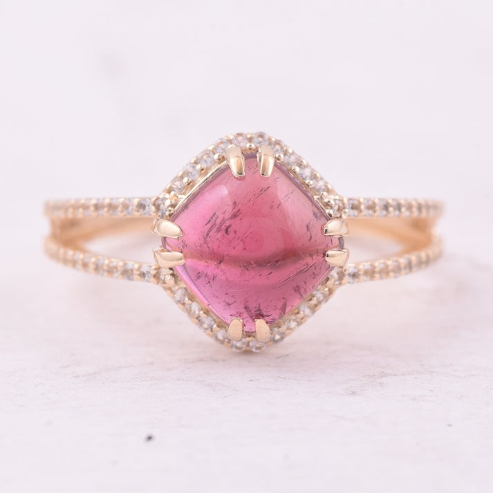 3.14 Ct Cushion Tourmaline 9K Gold Ring: 3.14 Total Carat Tourmaline 9K Gold Ring Specifications: Total Weight 2.44 g Center Gemstone Tourmaline Gemstone Carat Weight 2.83 Carats Gemstone Measurements 8X8 mm Additional Gemstones White Sapphi