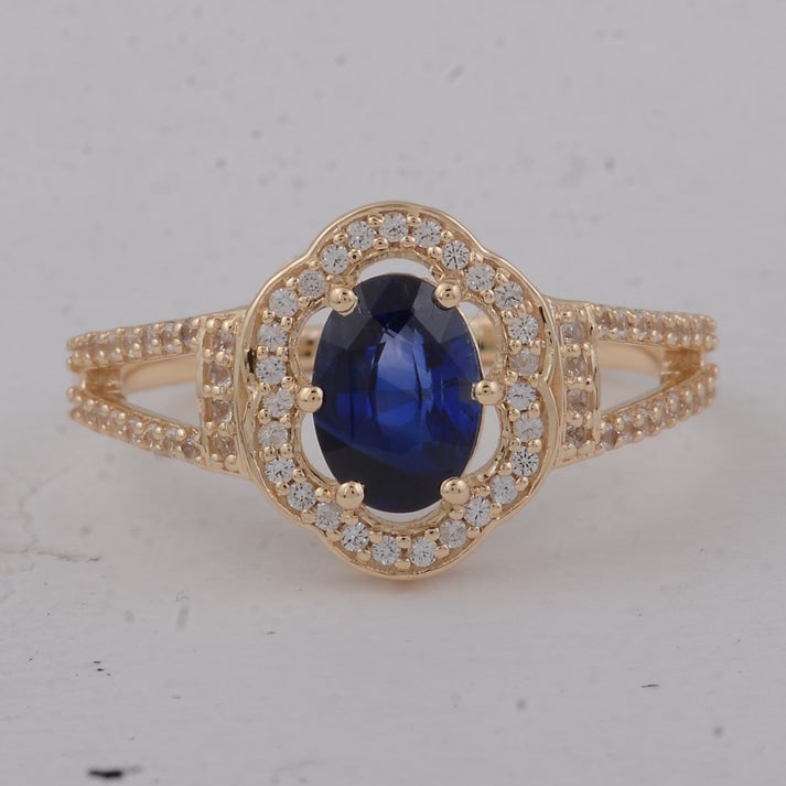 1.42 Ct Oval Sapphire 9K Gold Ring: 1.42 Total Carat Sapphire 9K Gold Ring Specifications: Total Weight 2.49 g Center Gemstone Sapphire Gemstone Carat Weight 1.13 Carats Gemstone Measurements 7.30X5.20X3.60 mm Additional Gemstones