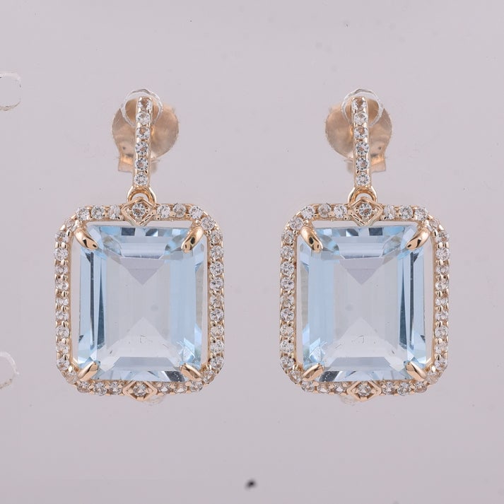 8.02 Ct Octagon Blue Topaz 9K Gold Earrings: 8.02 Total Carat Blue Topaz 9K Gold Earrings Specifications: Total Weight 3.405 g Center Gemstone Blue Topaz Gemstone Carat Weight 7.67 Carats Gemstone Measurements 10X8 mm Additional Gemstones White 