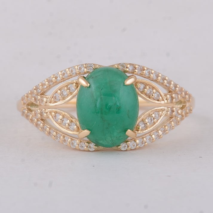 2.36 Ct Oval Emerald 9K Gold Ring: 2.36 Total Carat Emerald 9K Gold Ring Specifications: Total Weight 2.46 g Center Gemstone Emerald Gemstone Carat Weight 2.08 Carats Gemstone Measurements 9X7X4.50 mm Additional Gemstones White