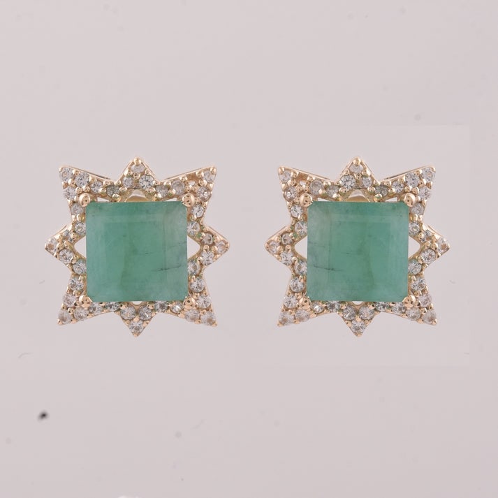 2.41 Ct Square Emerald 9K Gold Earrings: 2.41 Total Carat Emerald 9K Gold Earrings Specifications: Total Weight 2.039 g Center Gemstone Emerald Gemstone Carat Weight 2.08 Carats Gemstone Measurements 6X6 mm Additional Gemstones White Sapphir