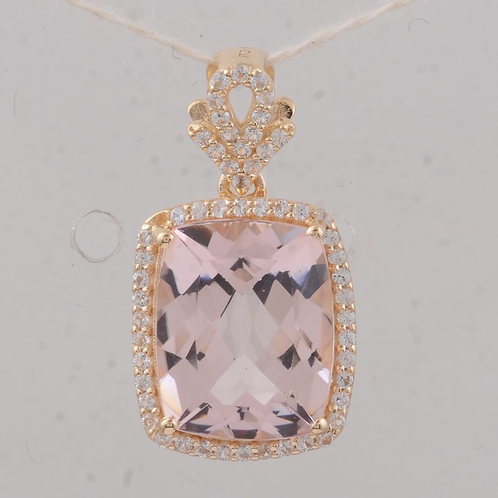 3.55 Ct Cushion Morganite 9K Gold Pendant: 3.55 Total Carat Morganite 9K Gold Pendant Specifications: Total Weight 2.01 g Center Gemstone Morganite Gemstone Carat Weight 3.3 Carats Gemstone Measurements 11X9X5.30 mm Additional Gemstones White
