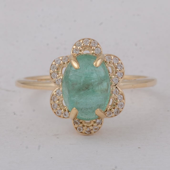 2.39 Ct Oval Emerald 9K Gold Ring: 2.39 Total Carat Emerald 9K Gold Ring Specifications: Total Weight 2.33 g Center Gemstone Emerald Gemstone Carat Weight 2.26 Carats Gemstone Measurements 9X6.70X5 mm Additional Gemstones White