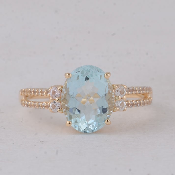 2.38 Ct Oval Aquamarine 9K Gold Ring: 2.38 Total Carat Aquamarine 9K Gold Ring Specifications: Total Weight 2.373 g Center Gemstone Aquamarine Gemstone Carat Weight 2.09 Carats Gemstone Measurements 10X8X4.50 mm Additional Gemstones