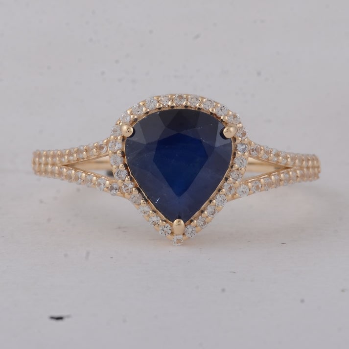 2.10 Ct Heart Blue Sapphire 9K Gold Ring: 2.10 Total Carat Blue Sapphire 9K Gold Ring Specifications: Total Weight 2.25 g Center Gemstone Blue Sapphire Gemstone Carat Weight 1.81 Carats Gemstone Measurements 8.20X7.50X4 mm Additional