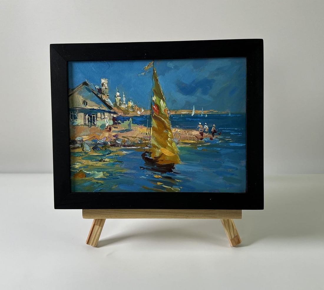 Oil painting House on the seashore Yuriy Suprunchuk: No. AAA5775The Oil painting Cardboard titled "House on the seashore" captures a radiant and lively coastal scene that brings together human presence, nature’s beauty, and the enduring relationship b