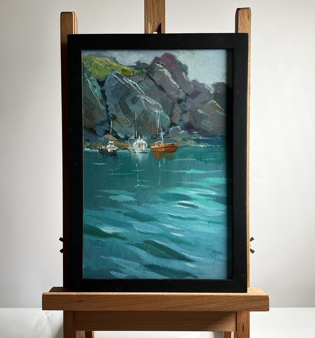 Oil painting The sea washes the mountains Yuriy Suprunchuk: No. AAA4135The oil painting on cardboard, titled "The Sea Washes the Mountains", captures a tranquil coastal scene where towering cliffs meet the calm embrace of the water. The artist skillfully conve