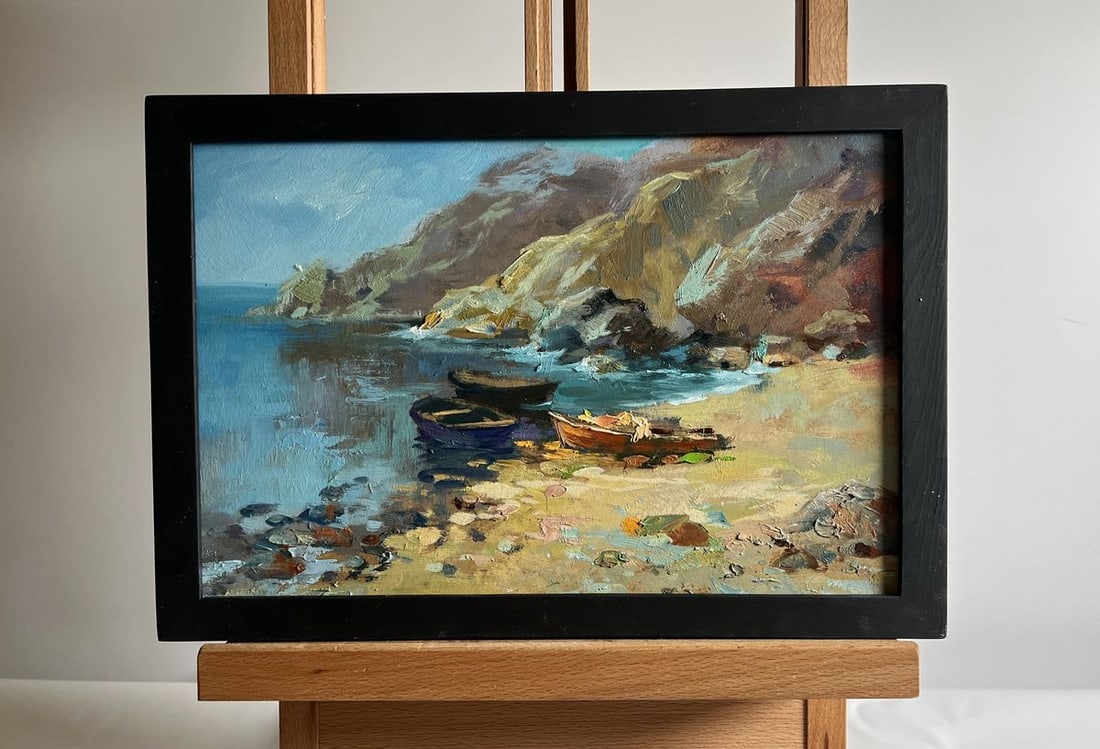 Oil painting Dream of the sea and mountains Yuriy Suprunchuk: No. AAA4142The oil painting on cardboard, titled "Dream of the Sea and Mountains", captures a tranquil coastal scene where the land and water meet in perfect harmony. The composition evokes a sense of