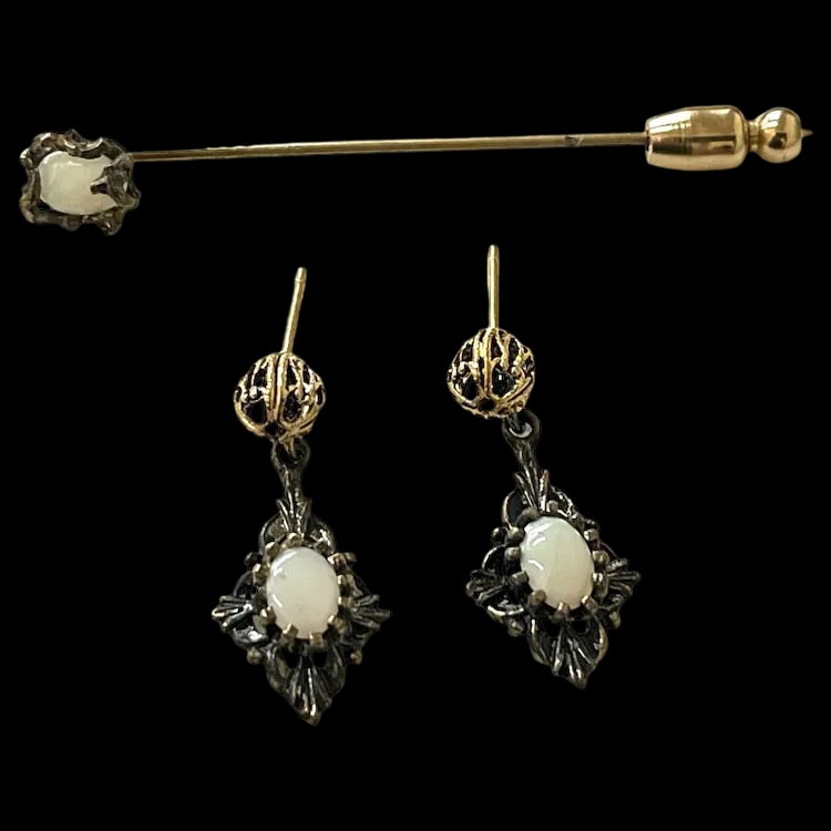 Vintage Filigree Opal Earrings and Stick Pin Set: Vintage Filigree Opal Earrings and Stick Pin SetHallmarked: No Hallmark SeenWeighs: 3 Grams Earrings Measure Approx: 1 x .40 inchStickpin Measures Approx: 2 inches length Vintage Hallmarked: No Hallma