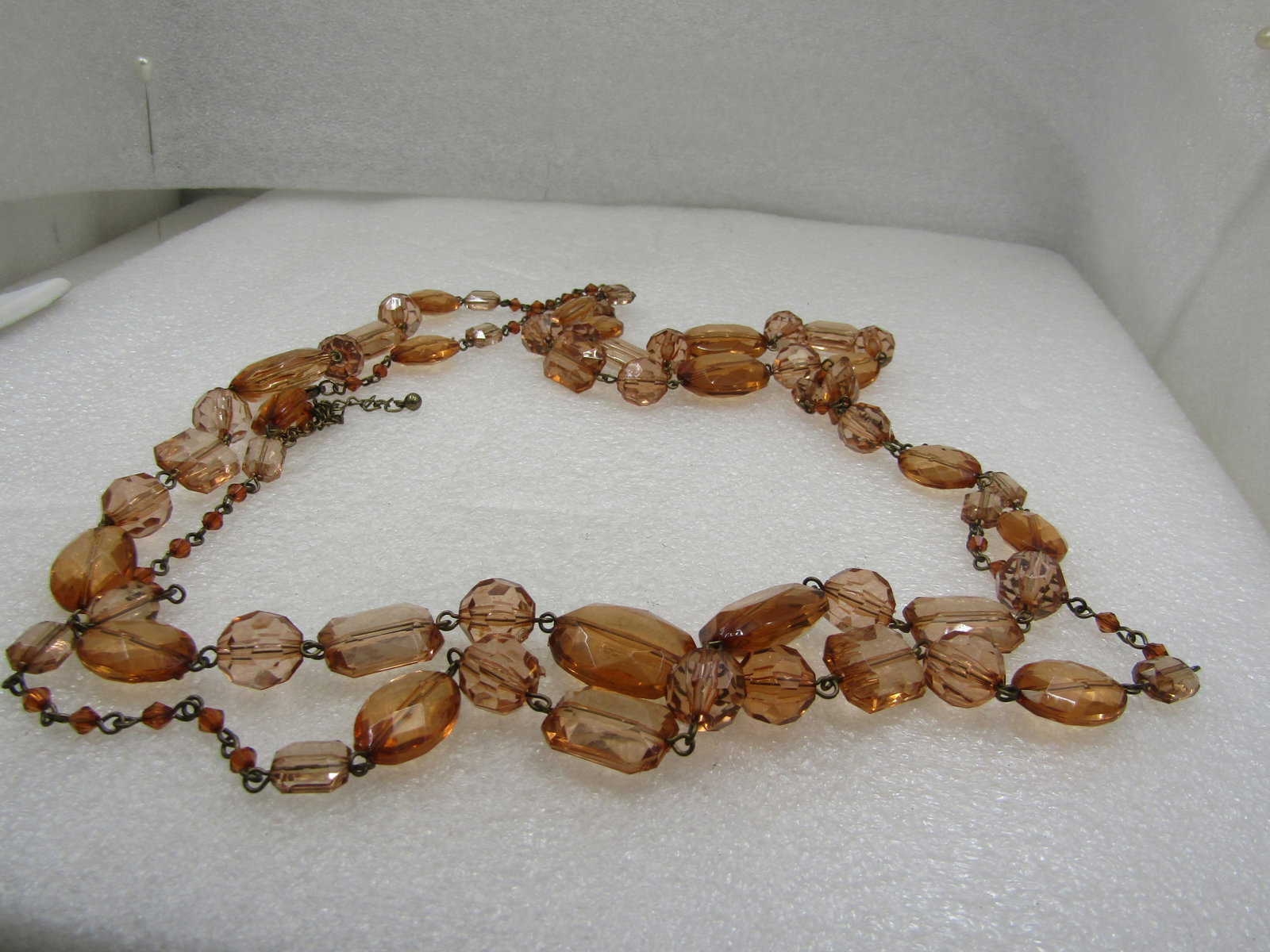 Vintage Graduated Orange and Gold Thread Necklace, 32" Multi-Strand: Vintage Honey Faceted Beaded Necklace, 32", Honey/Amber Acrylic Beads, 1980's. A mix of rectangular, round, oval beads in mixed sizes. The color is very appealing - clear beads that have the color of 
