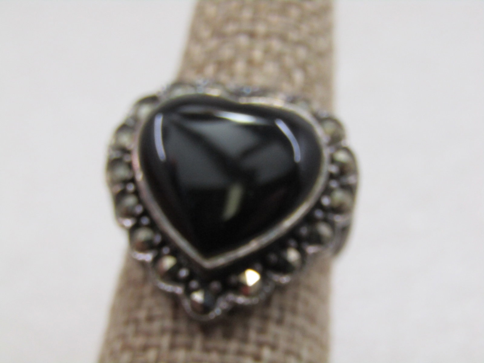 Vintage Sterling Onyx Heart & Marcasite Ring, Sz. 8.5: Vintage Sterling Onyx Heart & Marcasite Ring, Sz. 8.5, Appx. 1980's. Chunky ring with an appx. 15mm tall and wide bezel-set black onxy heart with a lower halo of marcasites. The ring is appx. 21mm dow